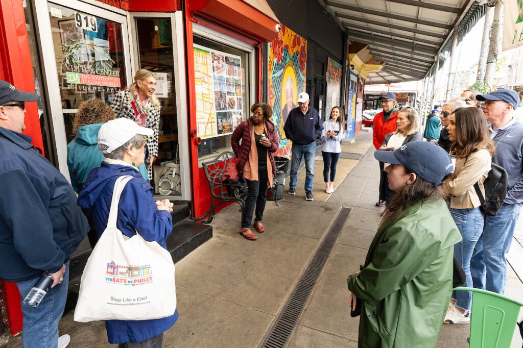 a group of people outside in a city